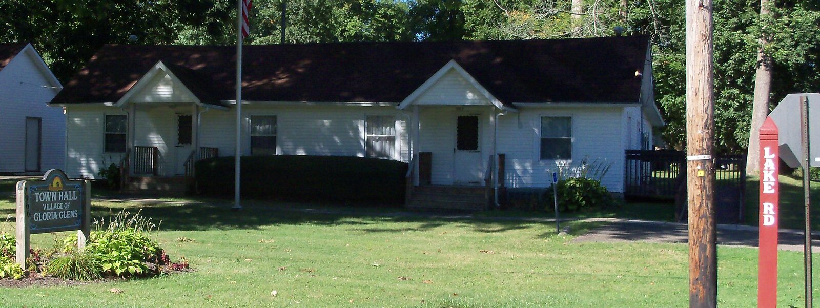Gloria Glens Park Village Town Hall on Lake Road, a small wood-sided municipal building.